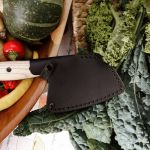 Morakniv Rombo Outdoor Cooking being used outdoors Knife